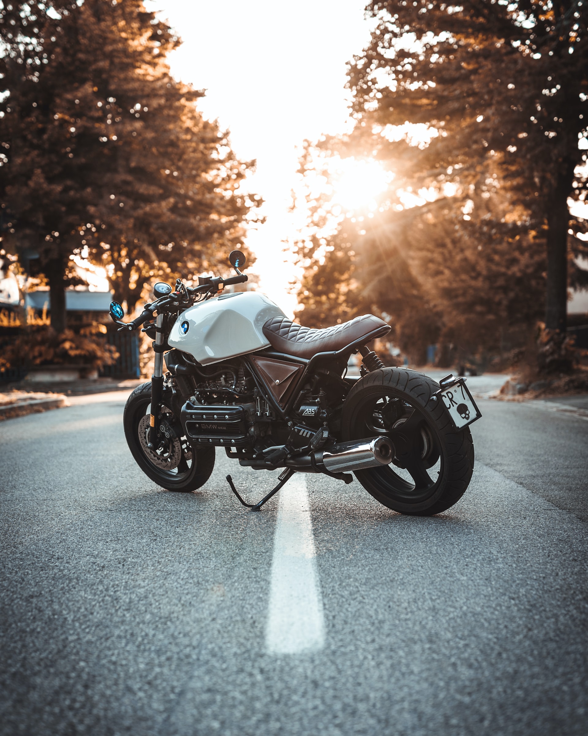 white-motorcycle-sunset